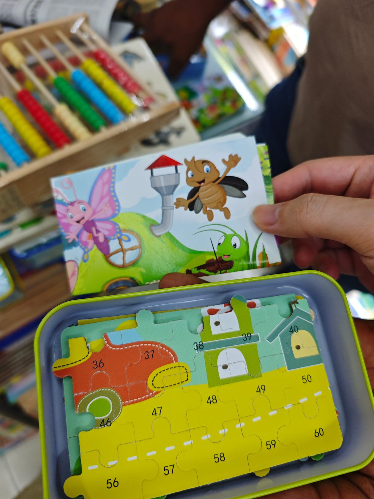 Number puzzle in tin box